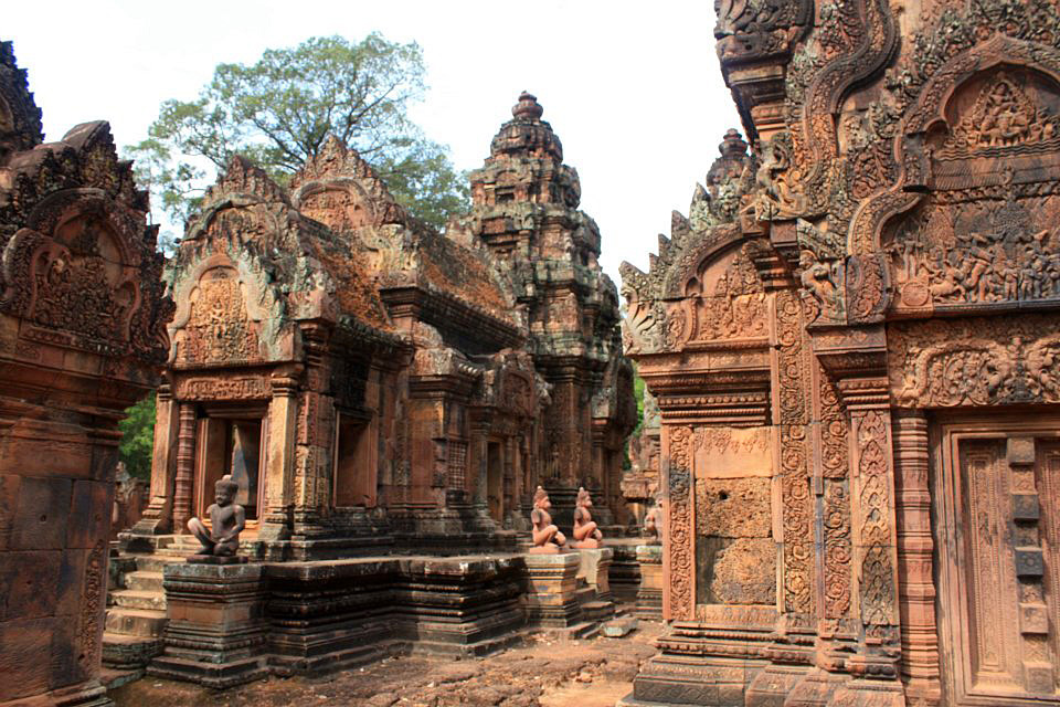 The intricate reliefs carving of red colored sandstone Banteay Srei temple, Siem Reap, Cambodia.